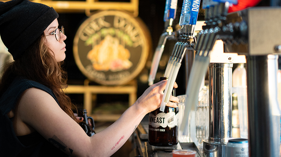 Bartender pouring drinks at Downeast Cider House