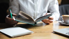 closeup of person looking at open book