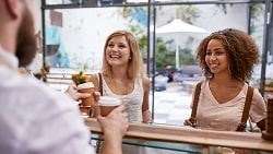 How to find buried treasure in your budget 2 women picking up coffee at shop