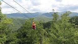 Get out of town ... on the cheap person on zipline