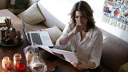 Organize your savings goals: How to create a realistic plan woman working on financial records