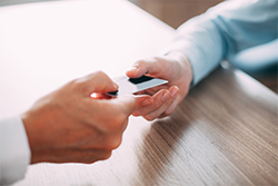 Keep tabs on your credit two hands passing credit card
