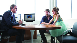 Planning and Paying for College: Some of Your Options Financial advisor with a man and small girl