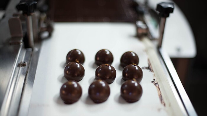 American South Food Editorial chocolate on conveyor belt
