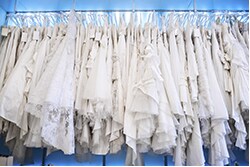 Sample sale wedding gowns on a rack