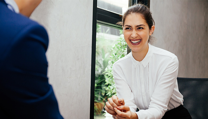 Women + Money Moments woman smiling