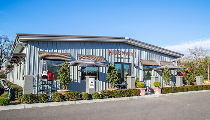 Andrea Mugnaini front of Mugnani oven manufacturing center