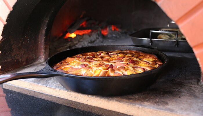 Andrea Mugnaini food in baking skillet at wood oven