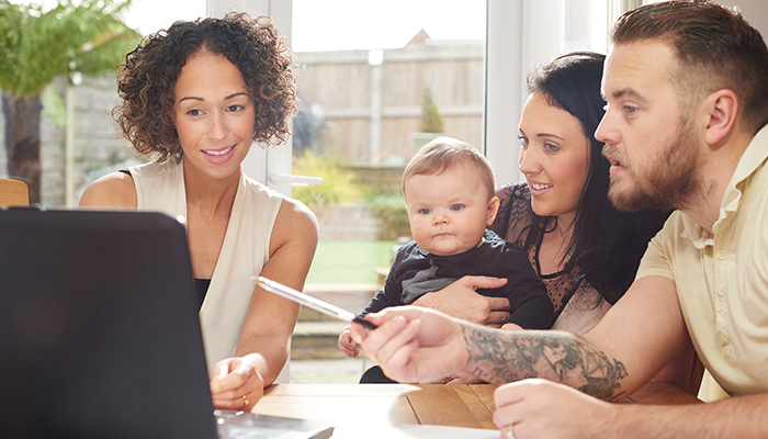 The 6 money-saving tips every parents need young parents and baby with financial advisor