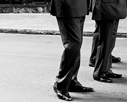 Your culture doesn't match your management style. Men in suit.