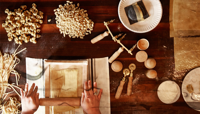 In The Kitchen With: Sarah G. at Monteverde chef making pasta from dough on kichen counter