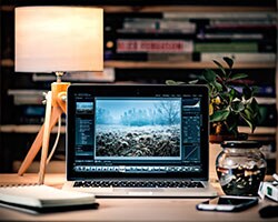 Define What's at Stake laptop on the desk