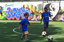 Heartbeat of the Community Kids playing soccer