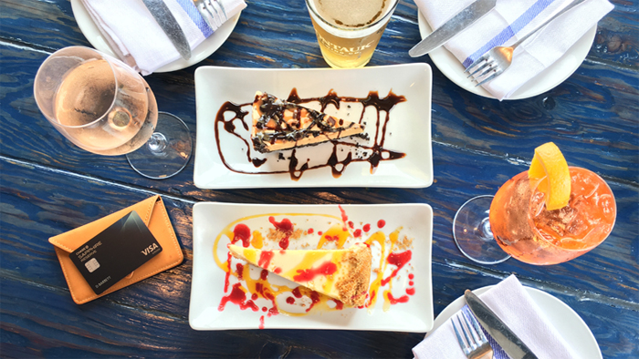 Montauk travel guide drinks and desert on a table with Chase Sapphire Reserve card