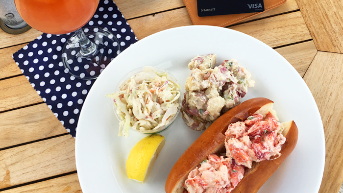 Montauk travel guide sea food in plate with drinks and Chase Sapphire Reserve card