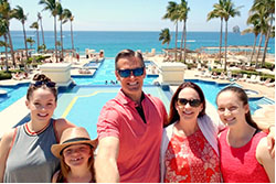 The art of getting paid - while getting away family taking a selfie