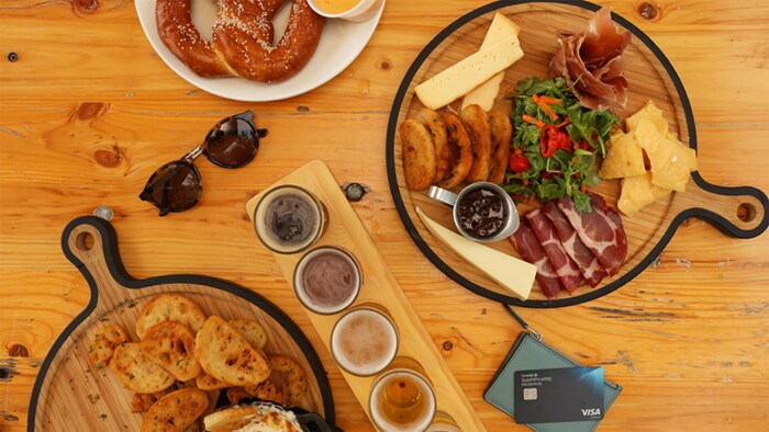 Charlotte Travel Guide food on table with Chase Sapphire Reserve card