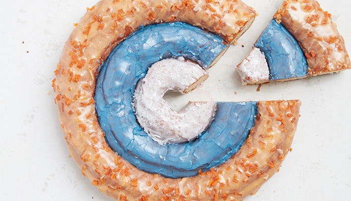The Ripple Effect: Doughnut Plant Leverages Points, Social Media to Launch Tasty New Product Line Three ring doughnut with sliced one wadge