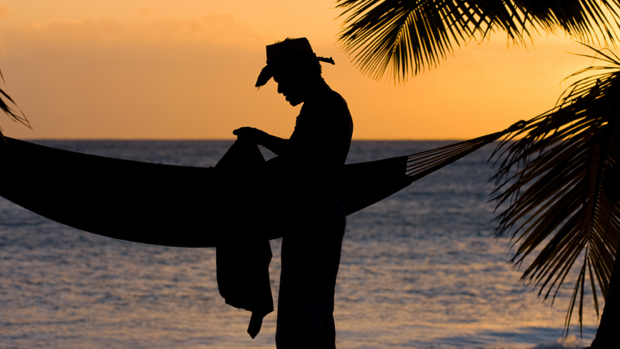 Four ways to have a meaningful vacation man at beach