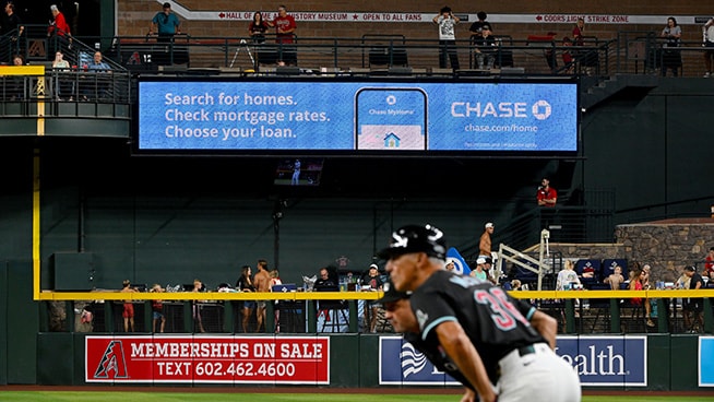 Diamondback outfielders with Chase banner in the background displaying Search for homes. Check mortgage rates. Choose your loan.