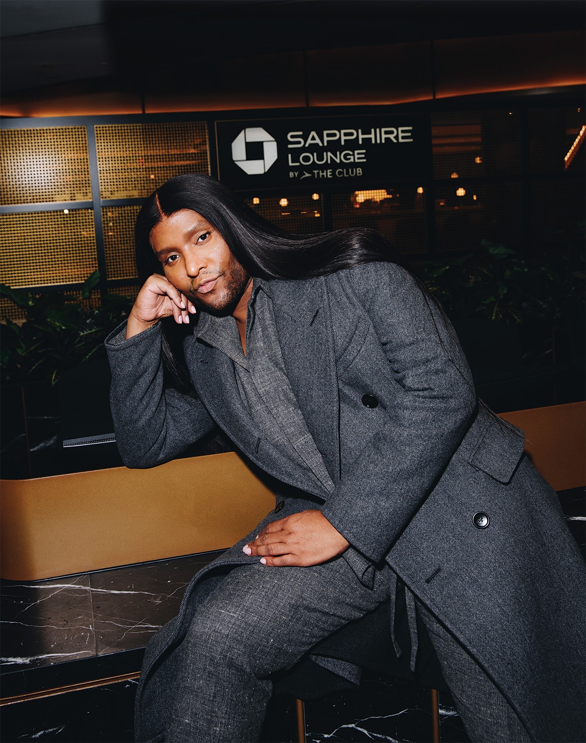 Law Roach poses near the front desk of the Chase Sapphire Reserve Lounge.