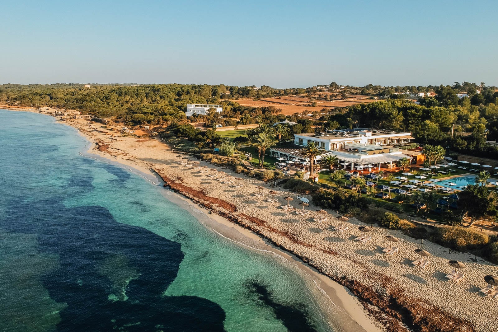 Aerial view of a hotel on the beach.
