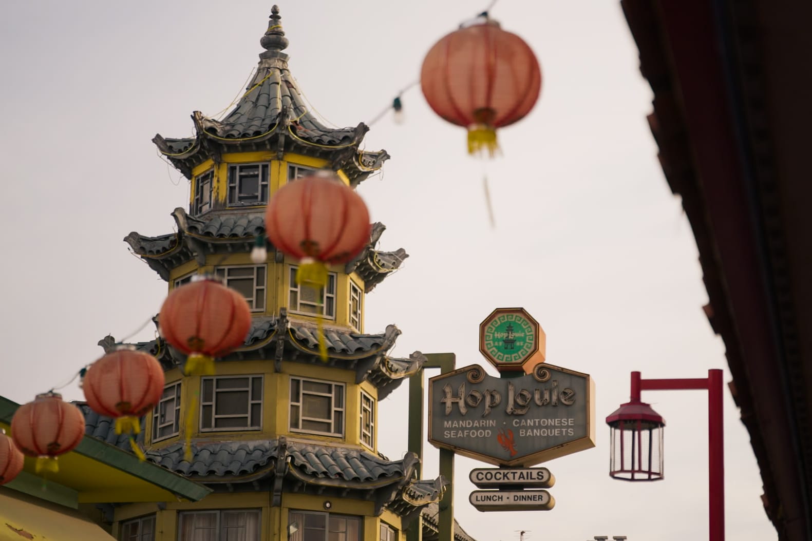 Lantern lights hang above a street in Chinatown, Los Angeles, California.