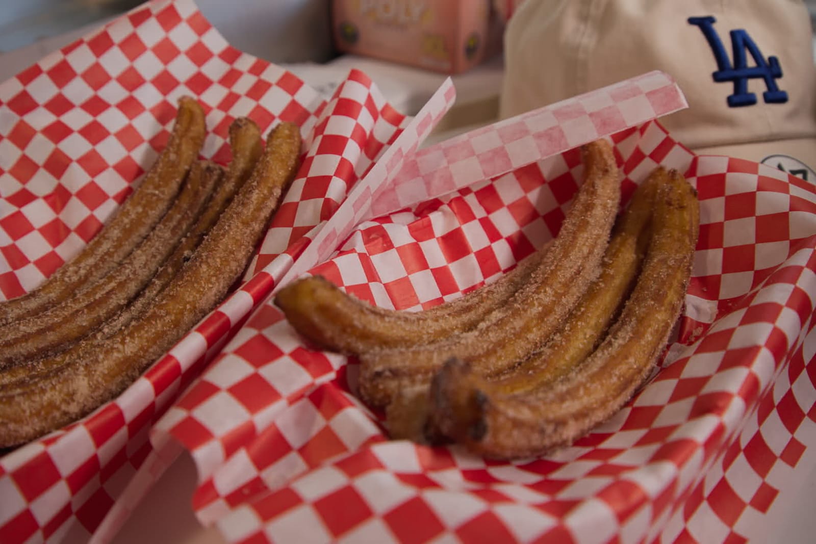 Two plates of churros.