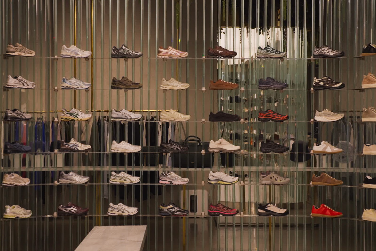 A display of sneakers on a wall.