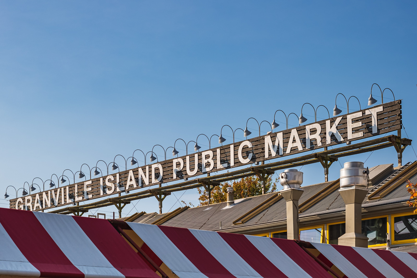 A large wooden facade reads Granville Island Public Market.