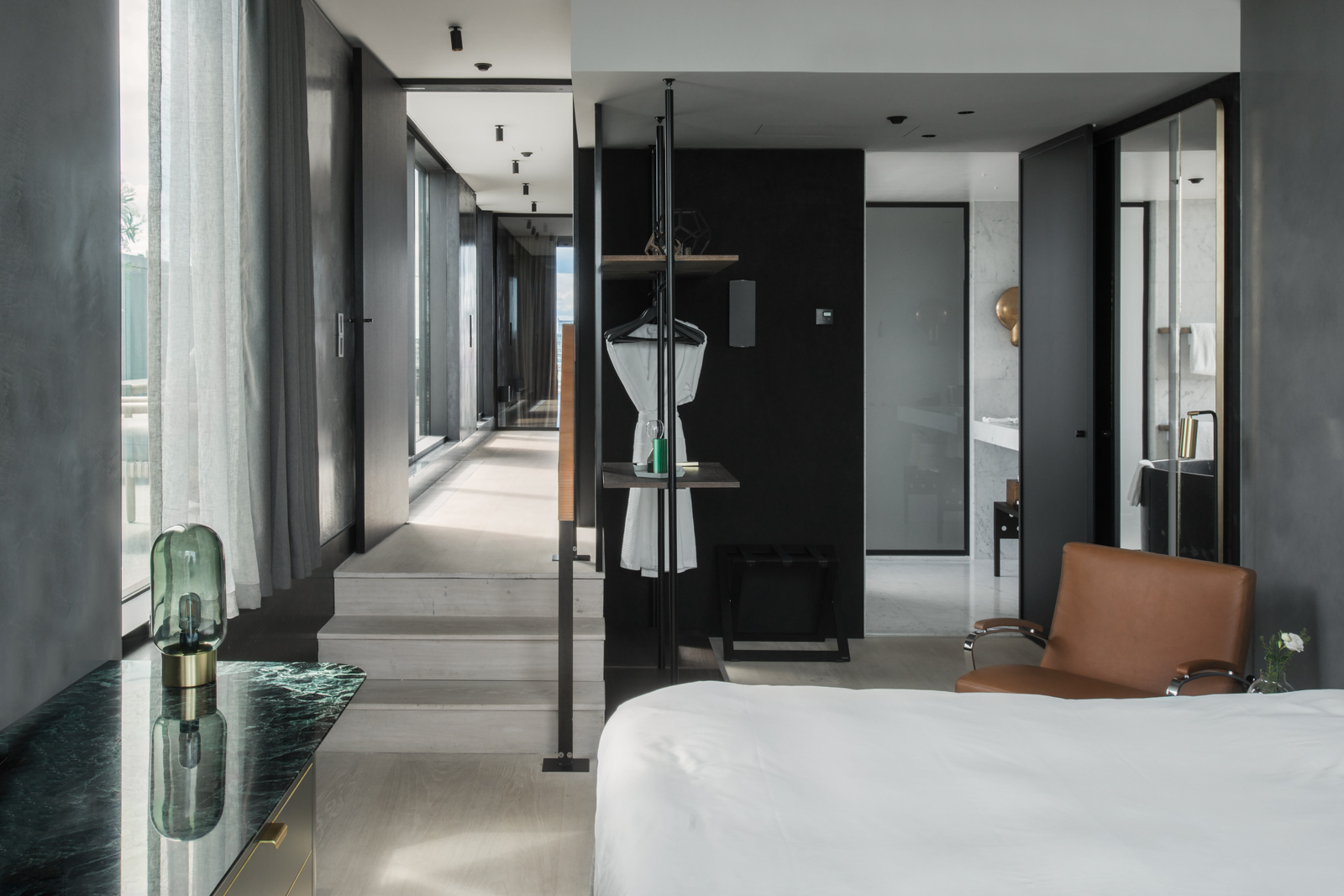 Bedroom with modern details and furnishings.