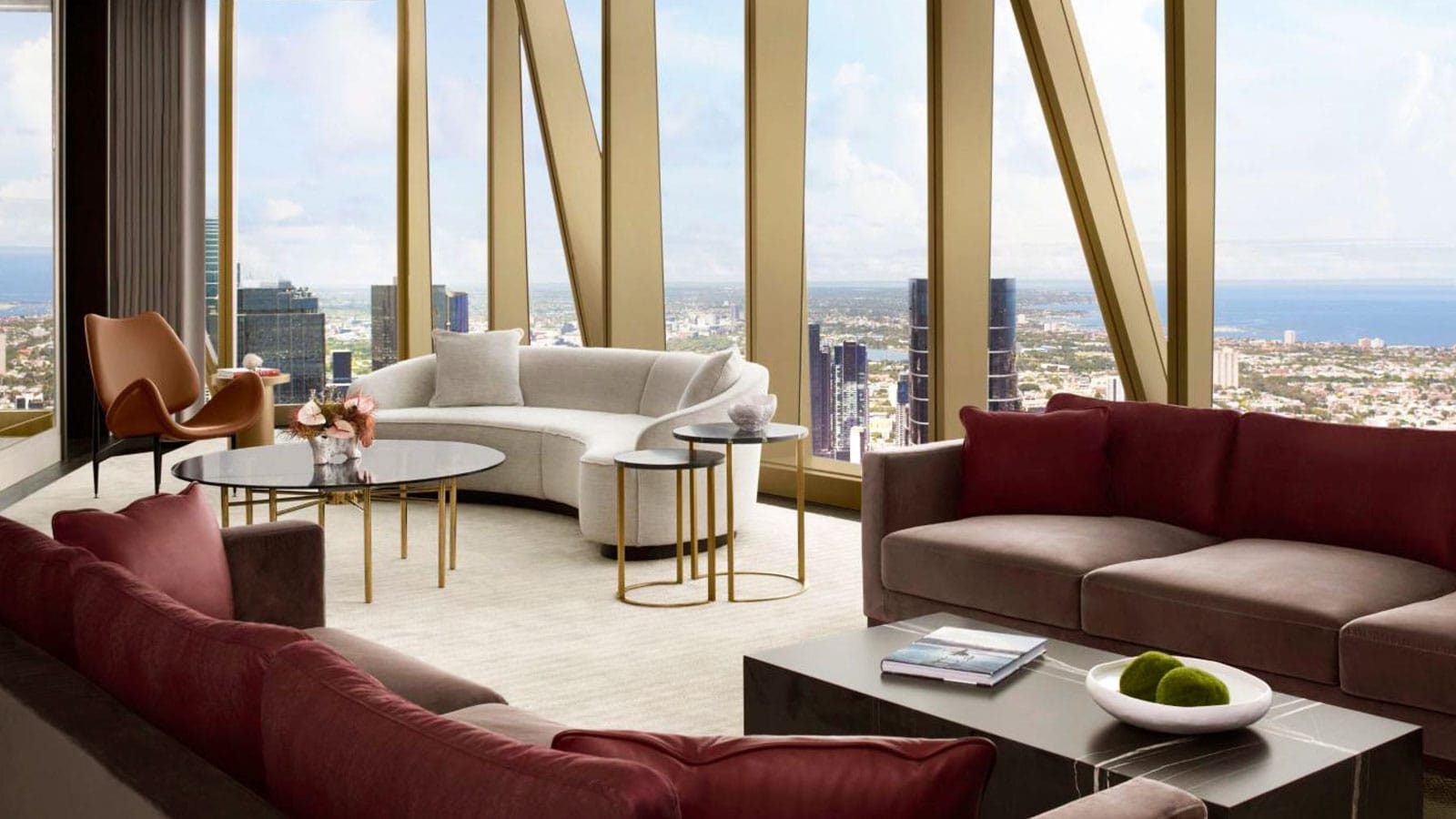 Sofas in front of windows overlooking city