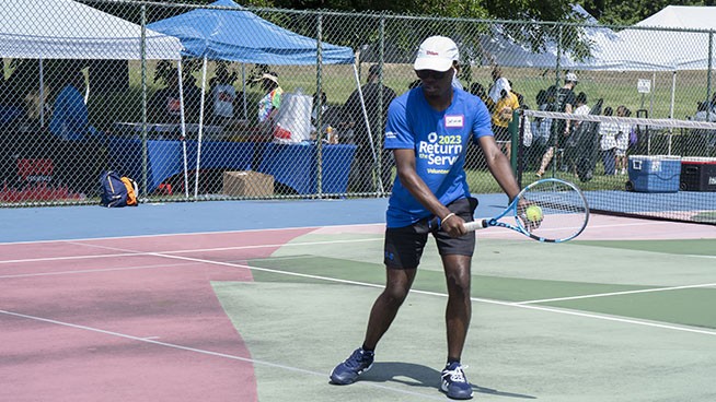 Tennis player serving 